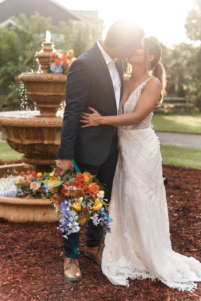 A couple embracing bold colors and Spanish-style decor at Bonita Ranch, a wedding venue in Melbourne, Florida, showcasing vibrant hues and elegant design.